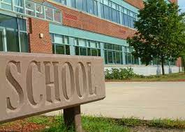 Large School sign in front of school building - Forum Training Professional  Development